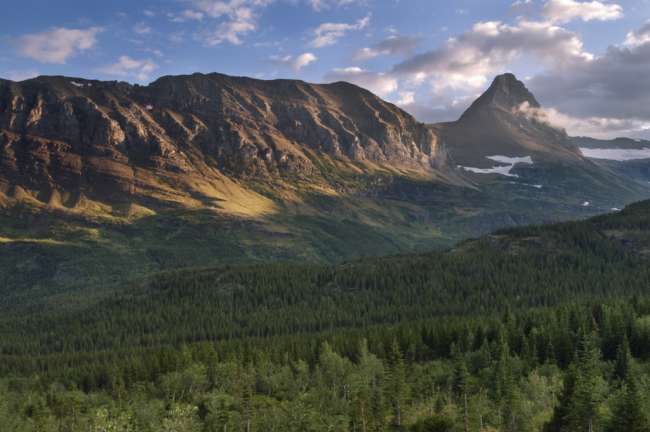 Distant mountain enclosed in clouds, Waterton Glacier International Peace Park, USA - Canada