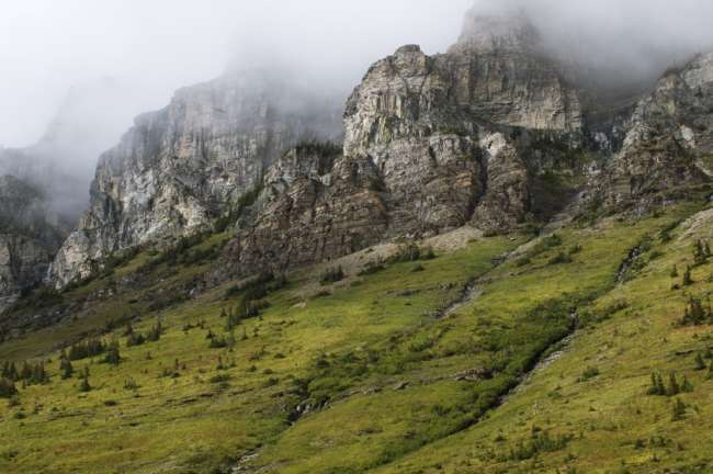 High peaks enclosed in clouds, Waterton Glacier International Peace Park, USA - Canada