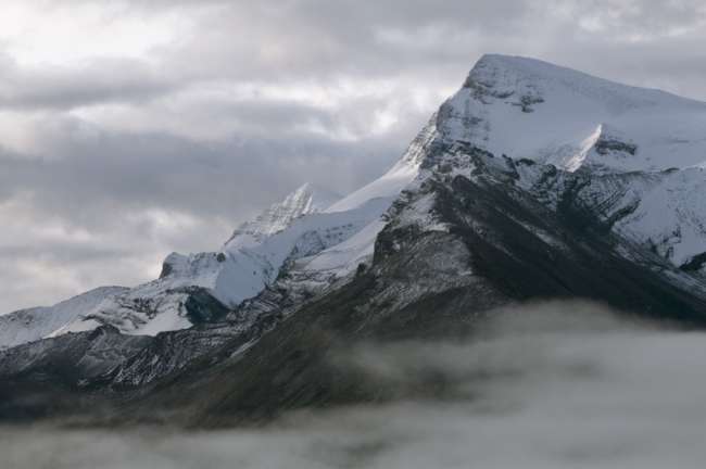 Snow covered peaks along the shore of Maligne lake, Jasper National Park, Jasper, Canada