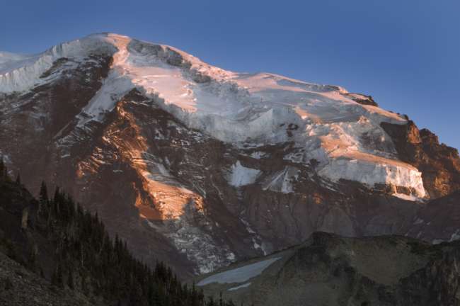 Alpine glow around the peak of Mount Rainier National Park, Washington, USA