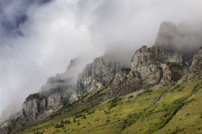 High peaks enclosed in clouds, Waterton Glacier International Peace Park, USA - Canada