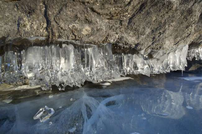 Ice beneath a rock, near McManus Island, Namakan Lake, Voyageurs National Park, Minnesota, USA