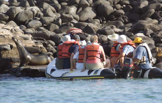 Tourists landing on the island of Espanola, Galapagos National Park, Ecuador