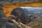 Mesa Arch reflected golden sunrise light, Island in the sky district, Canyonlands National Park, Utah, USA