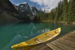 Canoe parked at a dock along Moraine Lake, Banff National Park, Banff, Canada