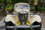 Charleston, South Carolina, USA.  A Brisitsh Coachworks Model 52 sits outside the front of a Charleston Home.  It is a replica of the famed 1952 MG TD.